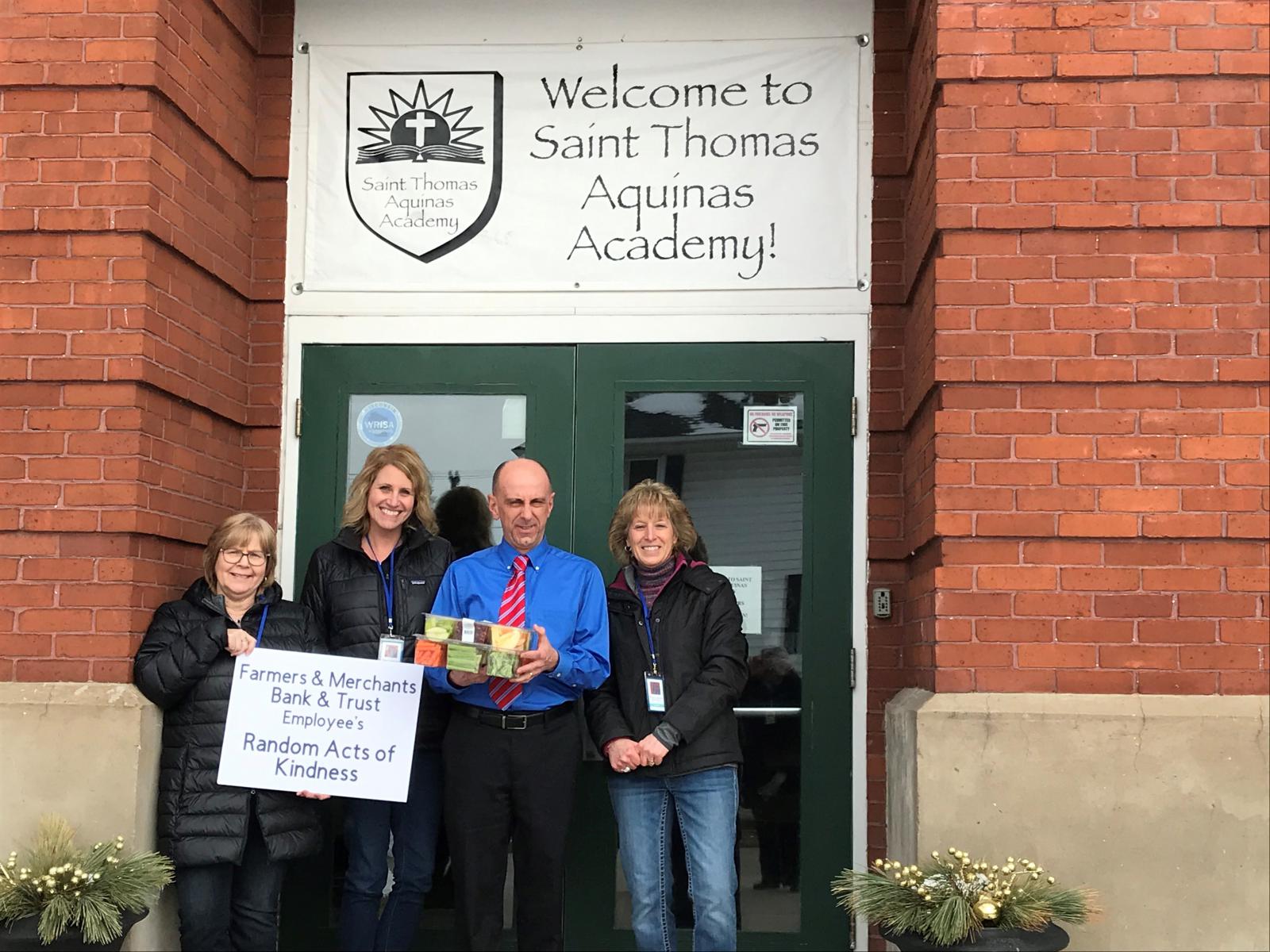 FMBT Employees delivering treats to Saint Thomas Aquinas Academy