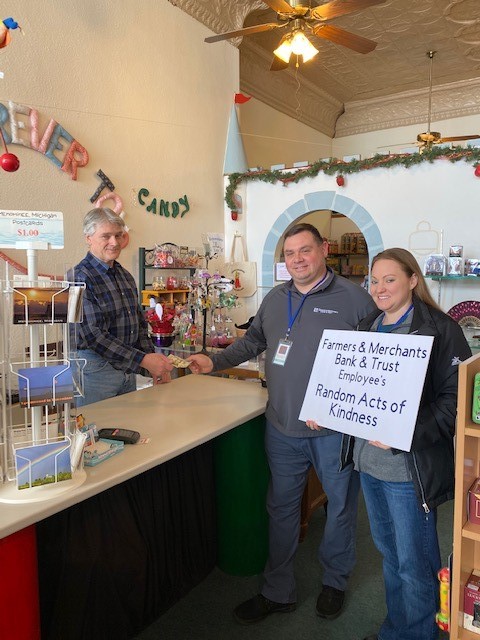 FMBT employees leaving money towards the next customer's purchase at a toy store