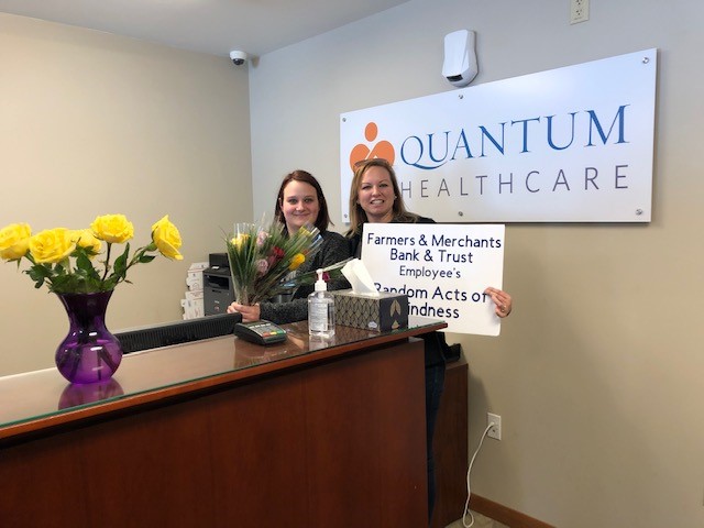 FMBT employee delivering flowers to Quantum Healthcare workers