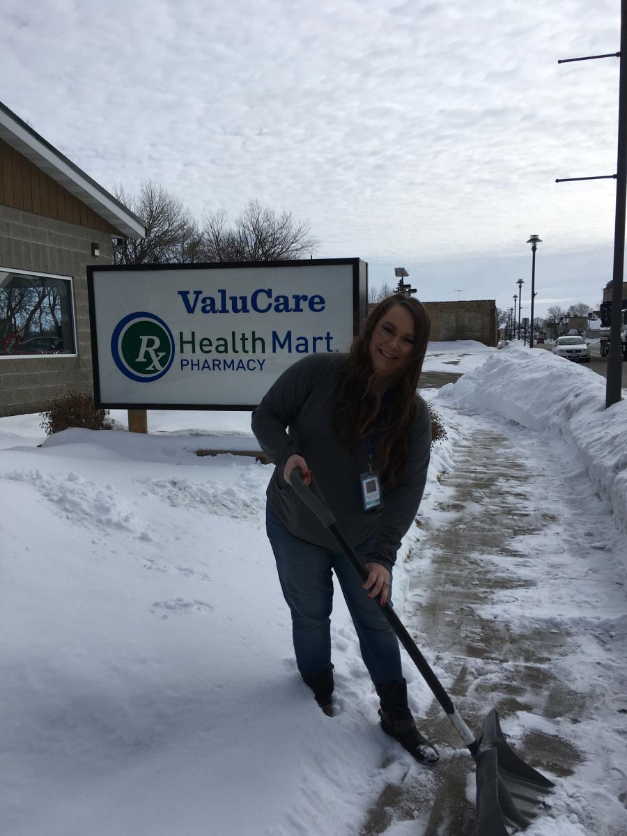 FMBT employee shoveling snow