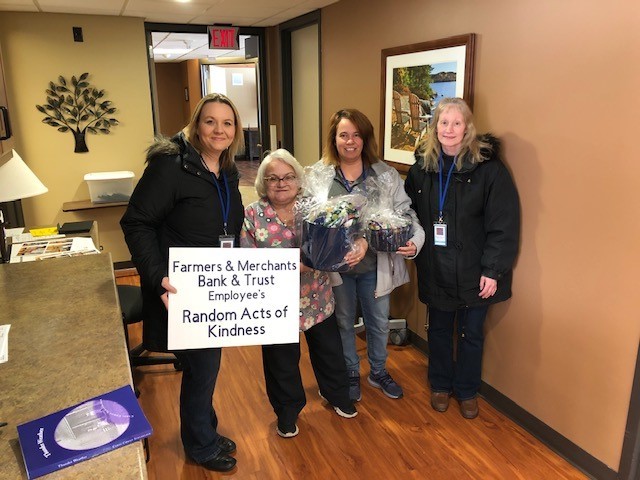 FMBT employees delivering a gift basket to Rennes East