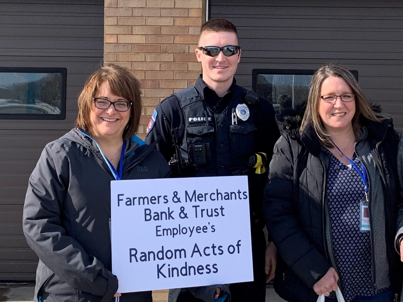 Employees bringing treats to the Menominee Police Department